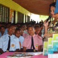 Dawasamu Secondary School students listening to their teacher