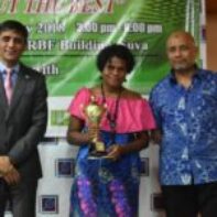 Young Entrepreneur of the Year - 1st Runner Up - Ms Anasitasia Tuidravu receiving her Award from Mr Shaheen Ali the Permanent Secretary for Industry, Trade and Tourism and Mr Saud Minam, the ANZ Fiji Country Head