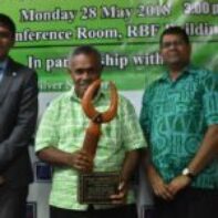 2017 Microfinance Service Provider (Banks) - Mr Isikeli Taoi of BSP receiving the Award from Mr Shaheen Ali the Permanent Secretary for Industry, Trade and Tourism and Mr Ariff Ali, Governor of the Reserve Bank of Fiji
