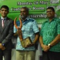 2017 Microfinance Service Provider (MFIs) - Mr Waisale Tuidama of NDP receiving the Award from Mr Shaheen Ali the Permanent Secretary for Industry, Trade and Tourism and Mr Ariff Ali, Governor of the Reserve Bank of Fiji